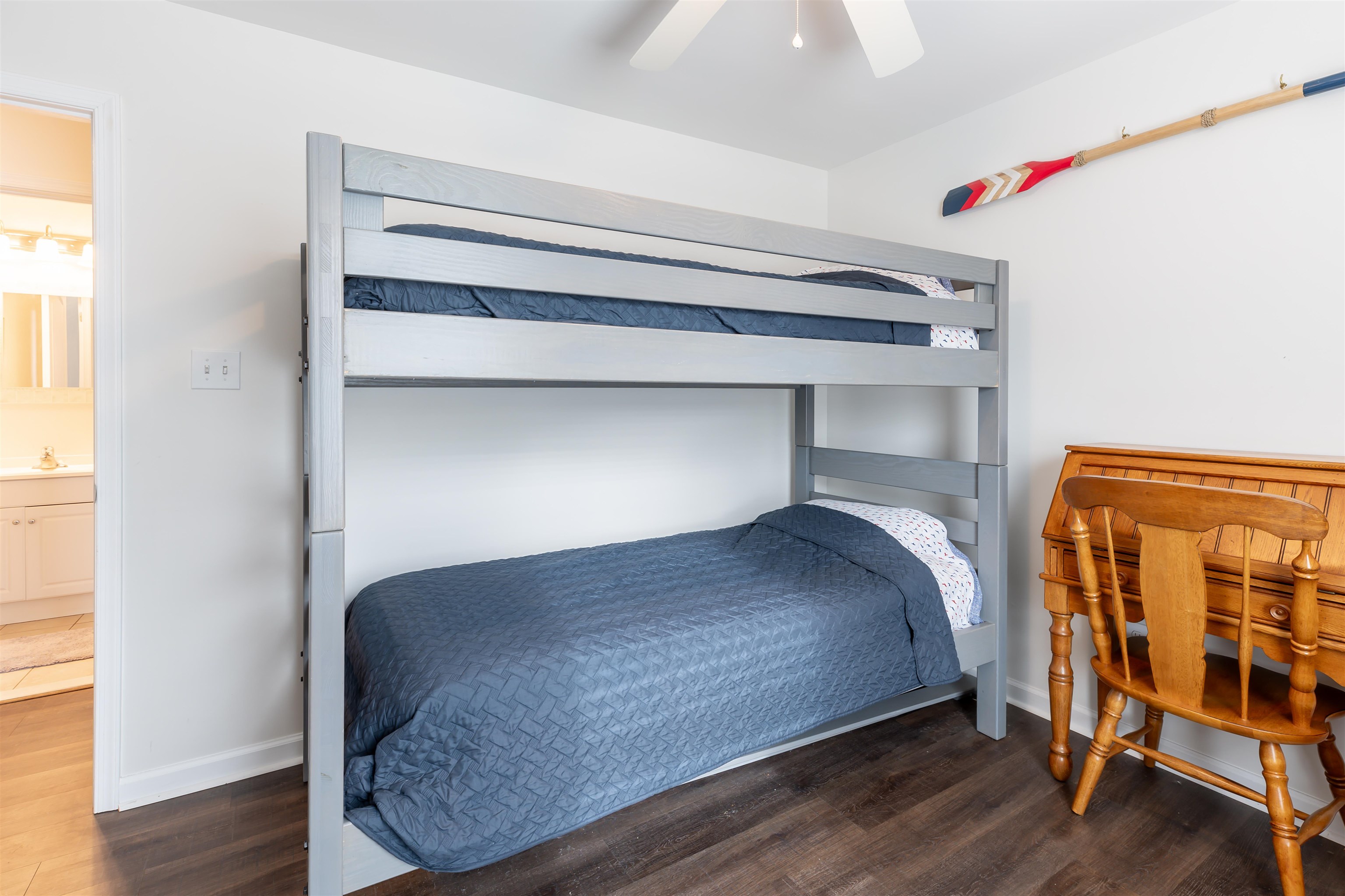 103 Avalon Road Cape May, NJ 08204 - Photo 25 of 33 a bedroom with a bunk bed and a wooden floor