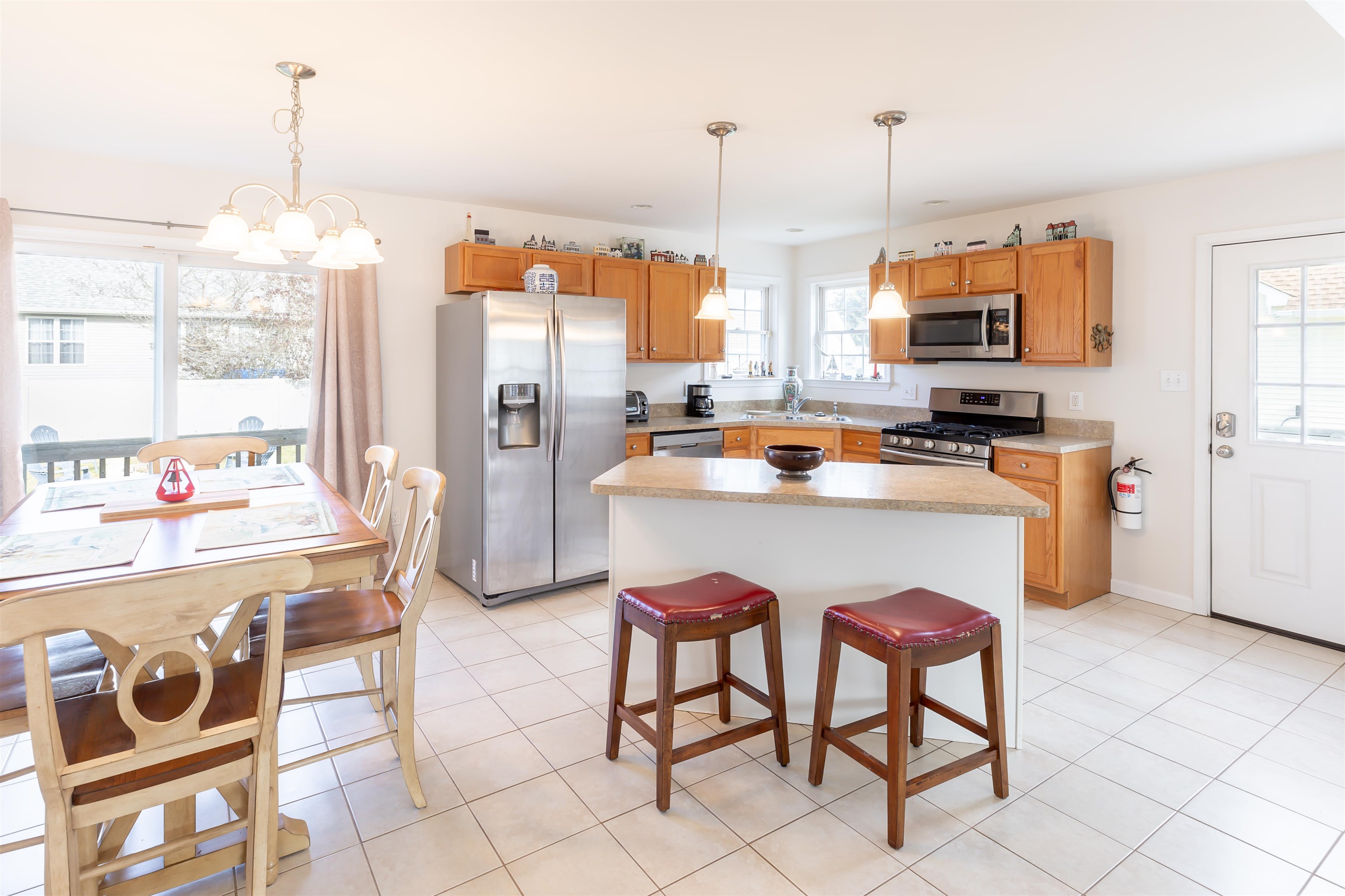 103 Avalon Road Cape May, NJ 08204 - Photo 8 of 33 a kitchen with stainless steel appliances granite countertop a stove a sink and a refrigerator