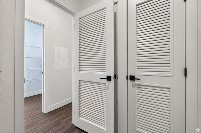 464 Jessop Avenue Hildale, UT 84784 - Photo 24 of 73 White louvered doors with matte black hardware, wood-finish flooring, and a walk-in closet featuring wire shelving