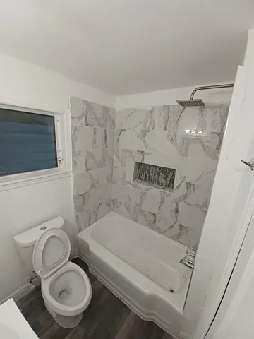 a bathroom with a toilet and a sink