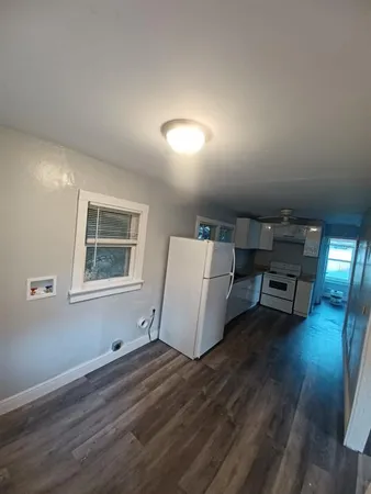 a room with furniture and a wooden floor