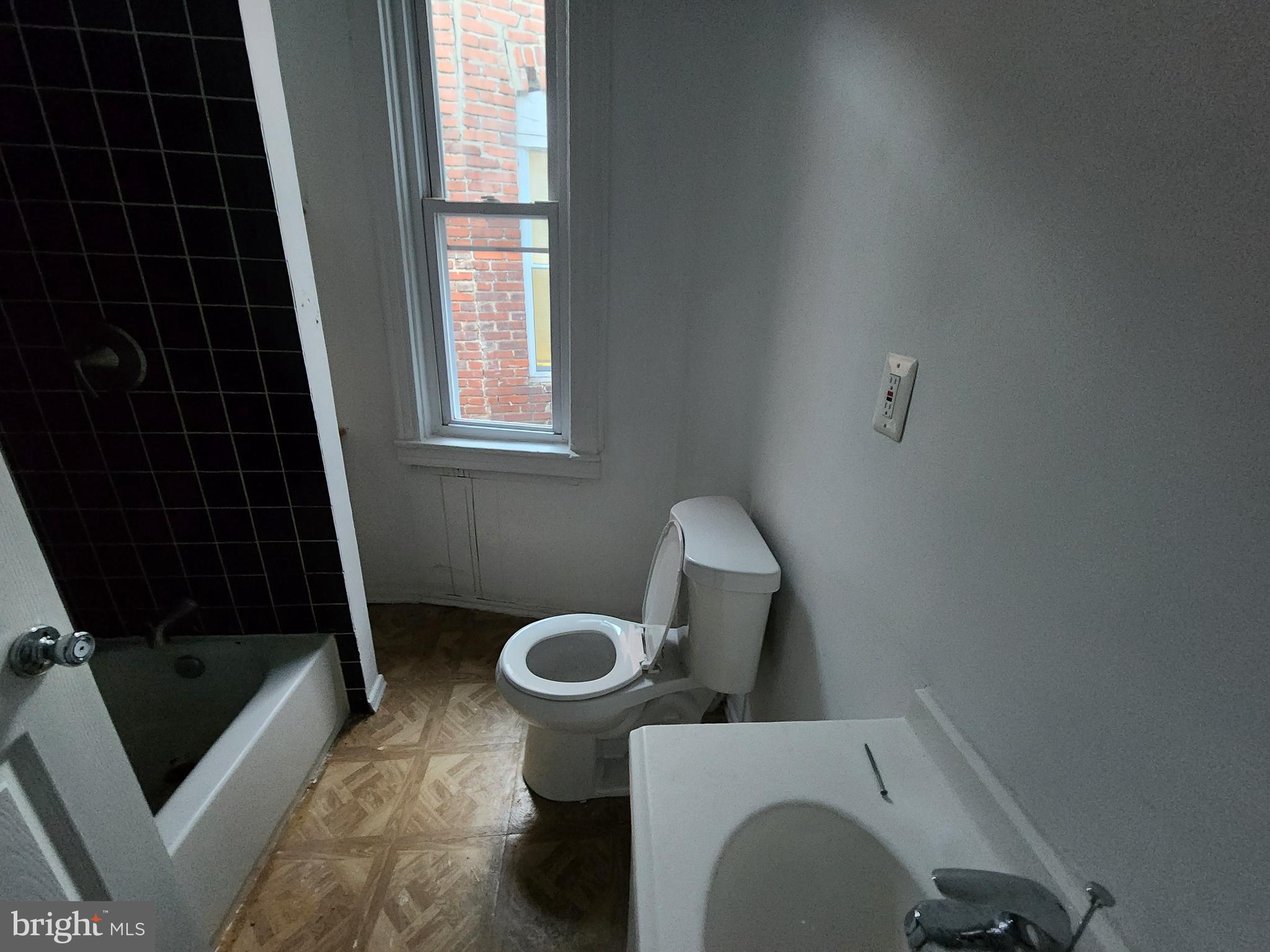 1916 West Lanvale Street Baltimore, MD 21217 - Photo 11 of 15 a bathroom with a sink toilet and shower