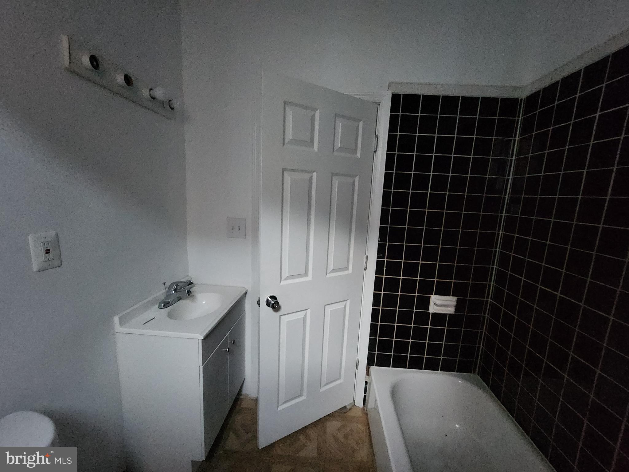 1916 West Lanvale Street Baltimore, MD 21217 - Photo 12 of 15 a bathroom with a sink toilet and shower