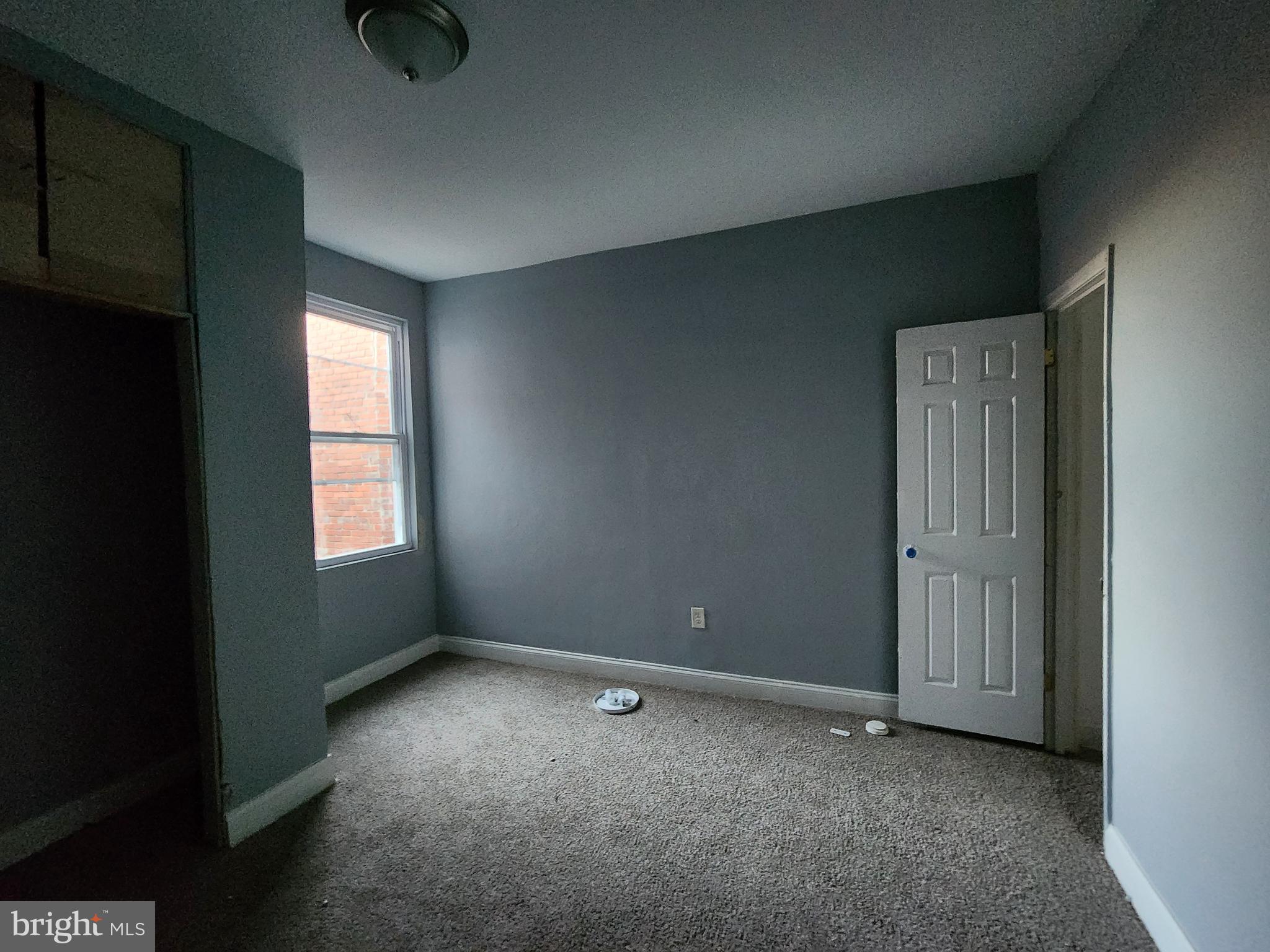 1916 West Lanvale Street Baltimore, MD 21217 - Photo 10 of 15 an empty room with windows and closet