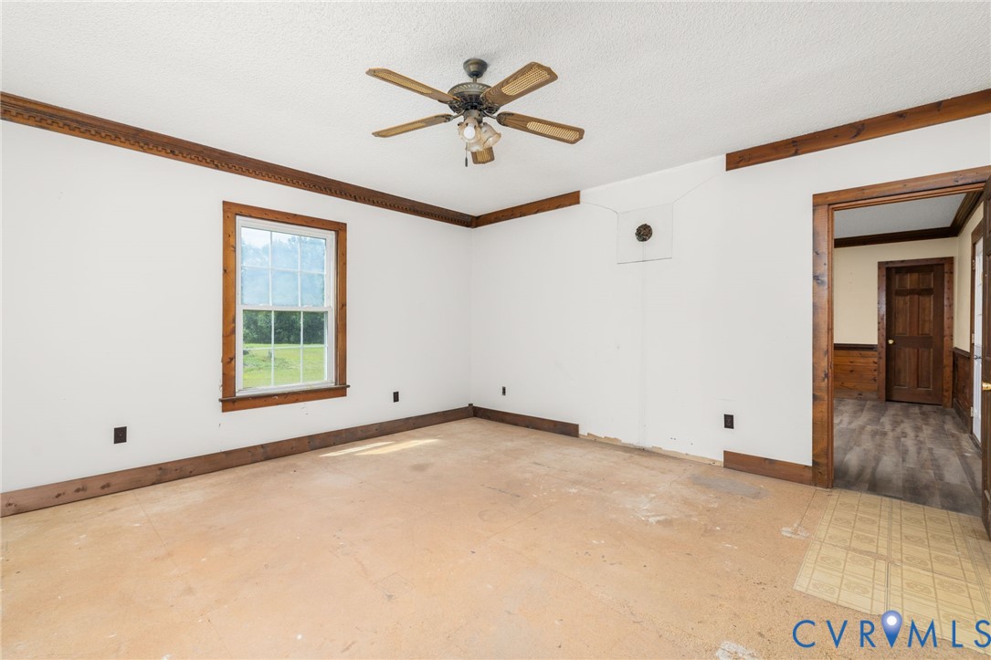26081 Mason Road Jarratt, VA 23867 - Photo 9 of 49 Spacious room featuring white walls, a single wind