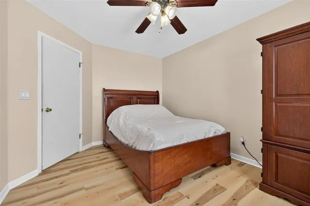 a bed room with a bed and a chandelier