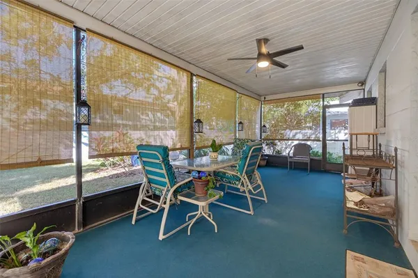 a dining room with furniture water view and pool table and chairs