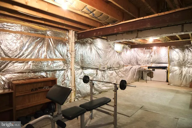 a view of gym equipment and refrigerator