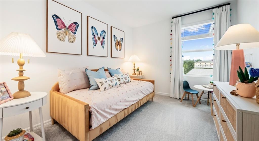 13154 Stable Place Parrish, FL 34219 - Photo 15 of 18 a bedroom with a bed and a couch