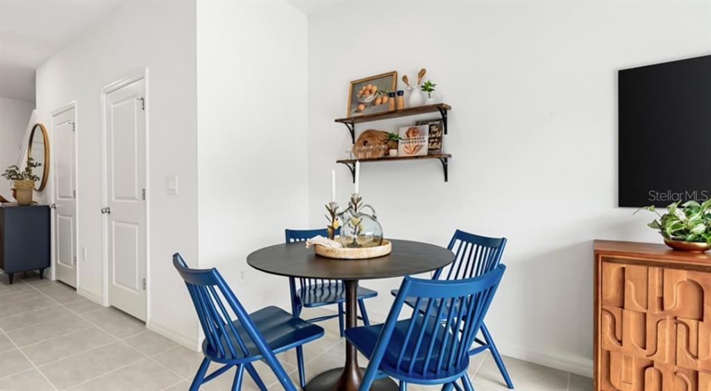13154 Stable Place Parrish, FL 34219 - Photo 9 of 18 a view of a dining room with furniture and wooden floor
