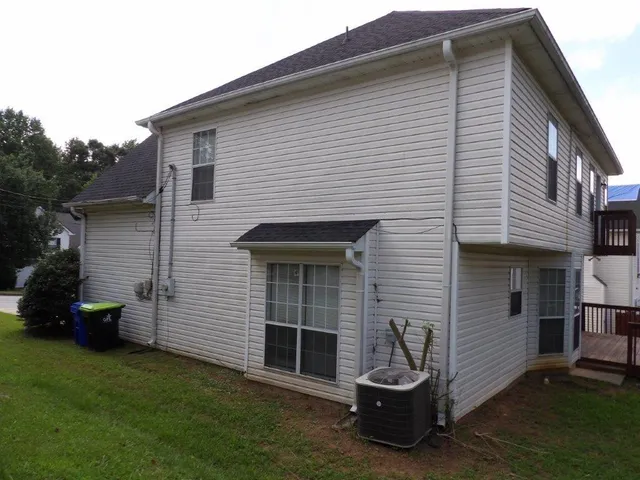 a view of a house with a back yard