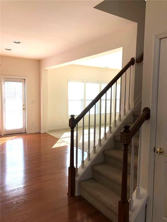 5876 Rue Villa Lane Tucker, GA 30084 - Photo 2 of 17 a view of staircase with wooden floor and stairs