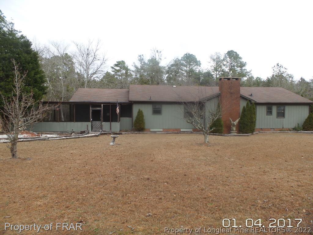 5141 Rockingham Road Laurel Hill, NC 28351 - Photo 1 of 14 a view of a house with a yard