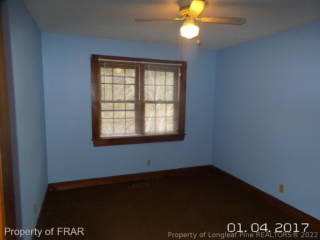 5141 Rockingham Road Laurel Hill, NC 28351 - Photo 11 of 14 an empty room with a window