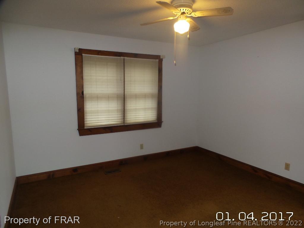 5141 Rockingham Road Laurel Hill, NC 28351 - Photo 12 of 14 an empty room with a window