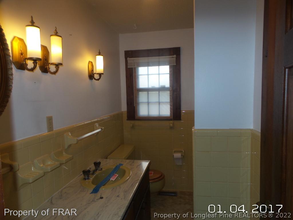 5141 Rockingham Road Laurel Hill, NC 28351 - Photo 14 of 14 a bathroom with a sink