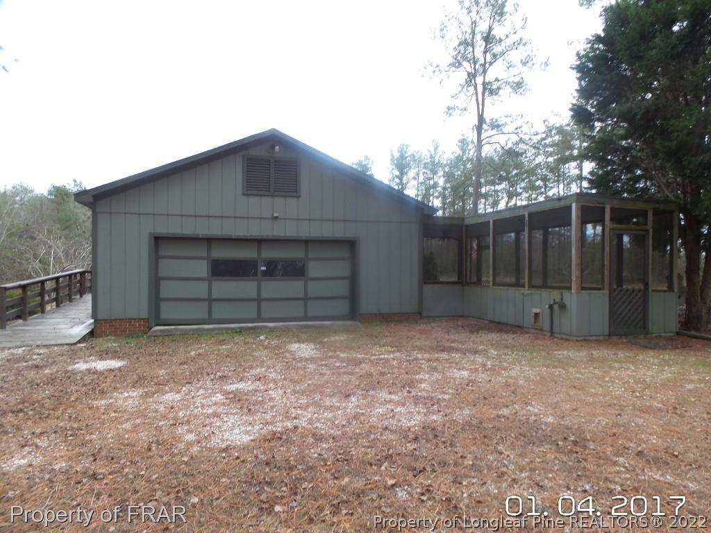5141 Rockingham Road Laurel Hill, NC 28351 - Photo 4 of 14 a house with yard in front of it