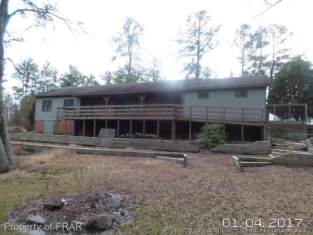 5141 Rockingham Road Laurel Hill, NC 28351 - Photo 5 of 14 a front view of house with yard