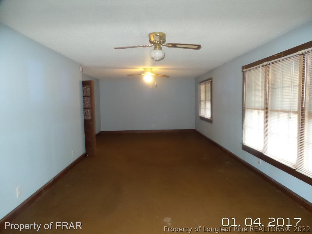 5141 Rockingham Road Laurel Hill, NC 28351 - Photo 8 of 14 a view of an empty room and window