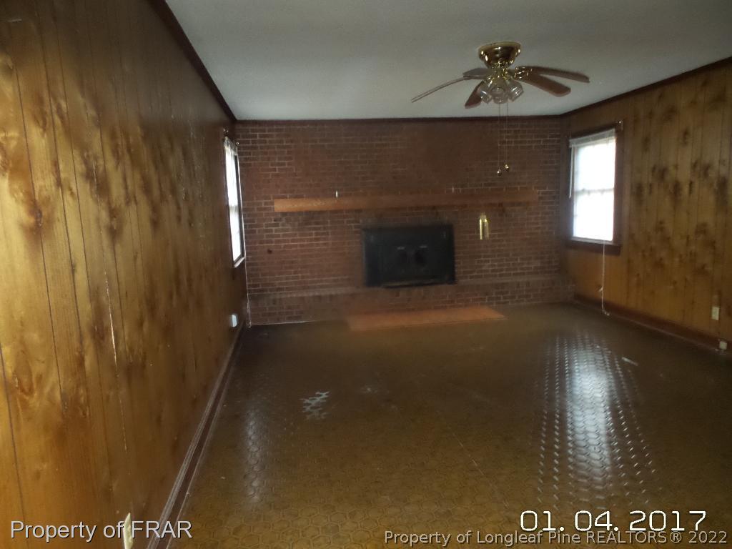 5141 Rockingham Road Laurel Hill, NC 28351 - Photo 9 of 14 a view of a livingroom with a fireplace