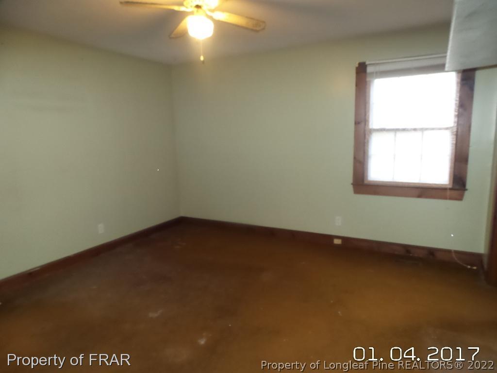 5141 Rockingham Road Laurel Hill, NC 28351 - Photo 10 of 14 an empty room with a window