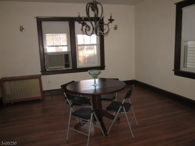 a view of a dining room with furniture and window