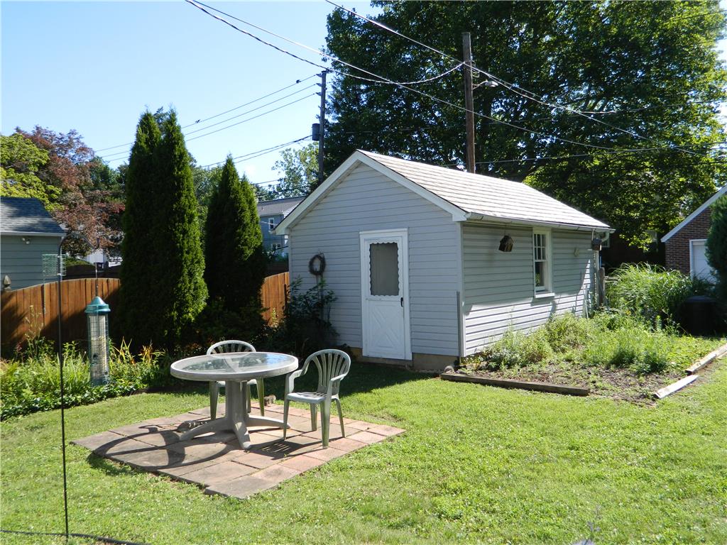 2130 Huntington Street Bethlehem, PA 18017 - Photo 3 of 23 A quaint backyard shed and patio create a charming outdoor retreat.