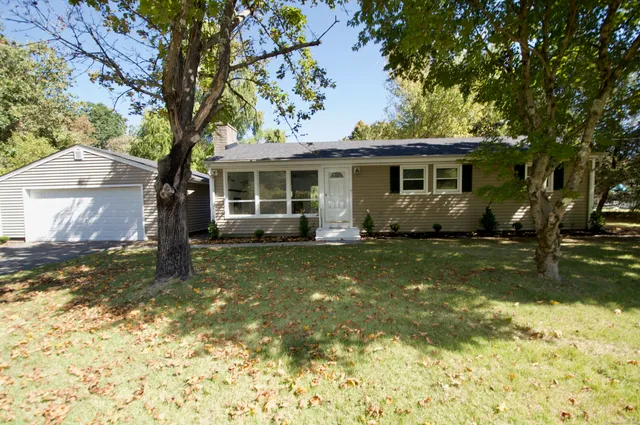 a view of a house with a yard