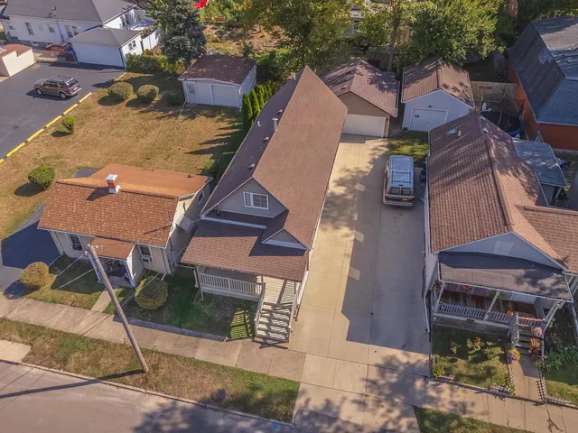 a aerial view of a house with table and chairs