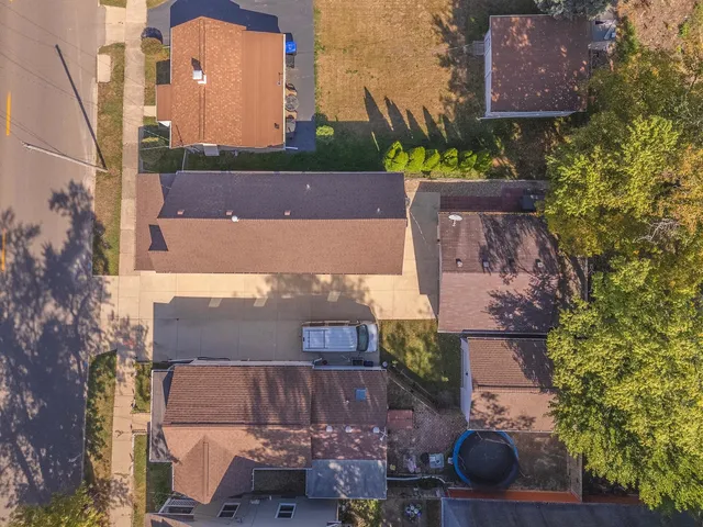 an aerial view of a house with a yard