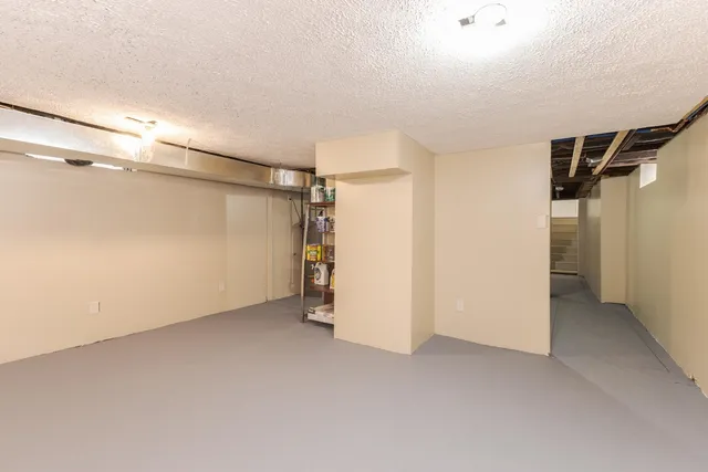 a view of a house with wooden floor and iron stairs