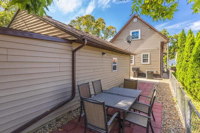 a view of a house with a backyard