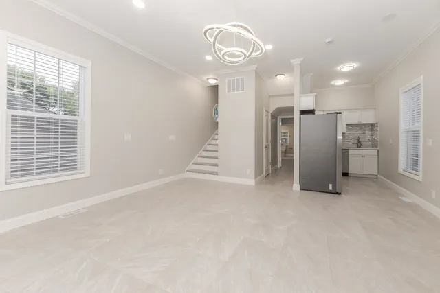 a kitchen with stainless steel appliances granite countertop a sink stove and microwave