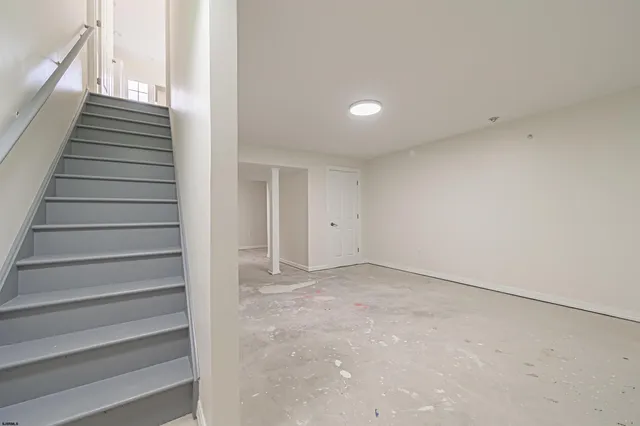 a view of an empty room with stairs