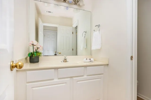 a bedroom with a bed a couch and a window