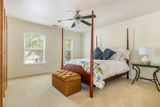 a bedroom with a bed and a book shelf