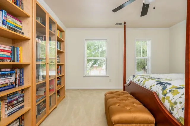 a white toilet sitting next to a bath tub