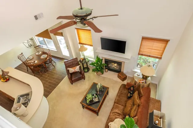 a view of a wooden chairs and table in the patio