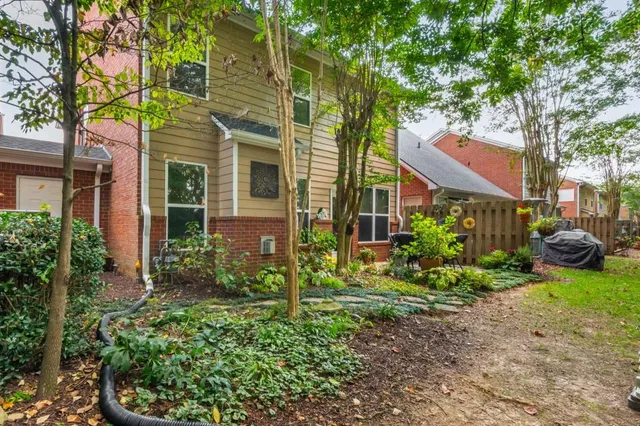 a view of a chair and tables in patio