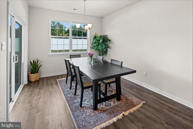 a workspace with furniture and a potted plant