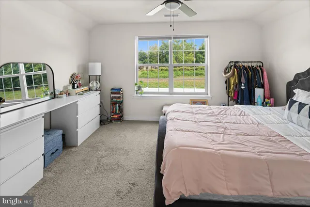 a bed room with a bed and a window