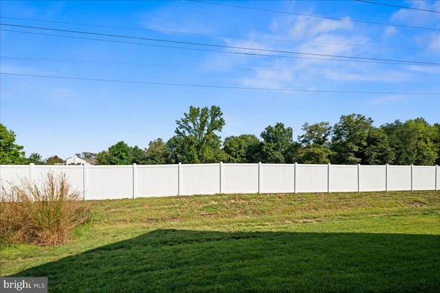 a view of a swimming pool with an outdoor space and seating area