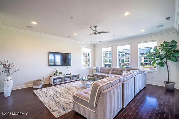 a view of a bedroom with furniture and windows