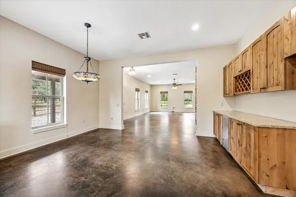 a view of an entryway with wooden floor