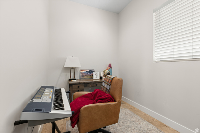 839 Walker Way St. George, UT 84770 - Photo 20 of 32 Compact room with neutral wall tones and wood-finish flooring