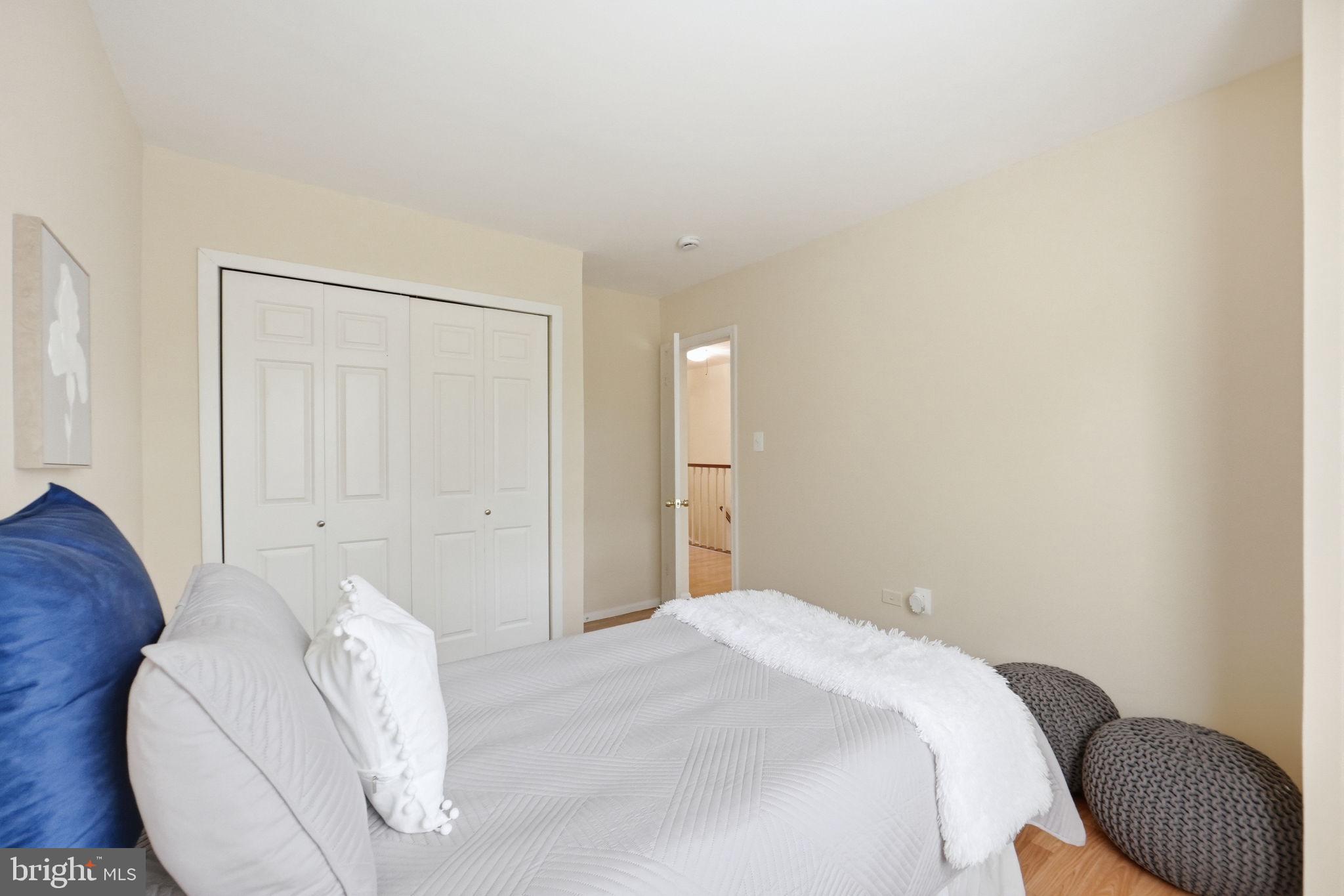 6470 Franconia Court Springfield, VA 22150 - Photo 16 of 31 a bedroom with a bed and a couch