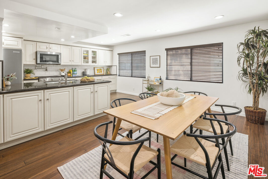4549 Alla Road, Unit 5 Marina del Rey, CA 90292 - Photo 14 of 35 a kitchen with stainless steel appliances kitchen island granite countertop a sink and cabinets