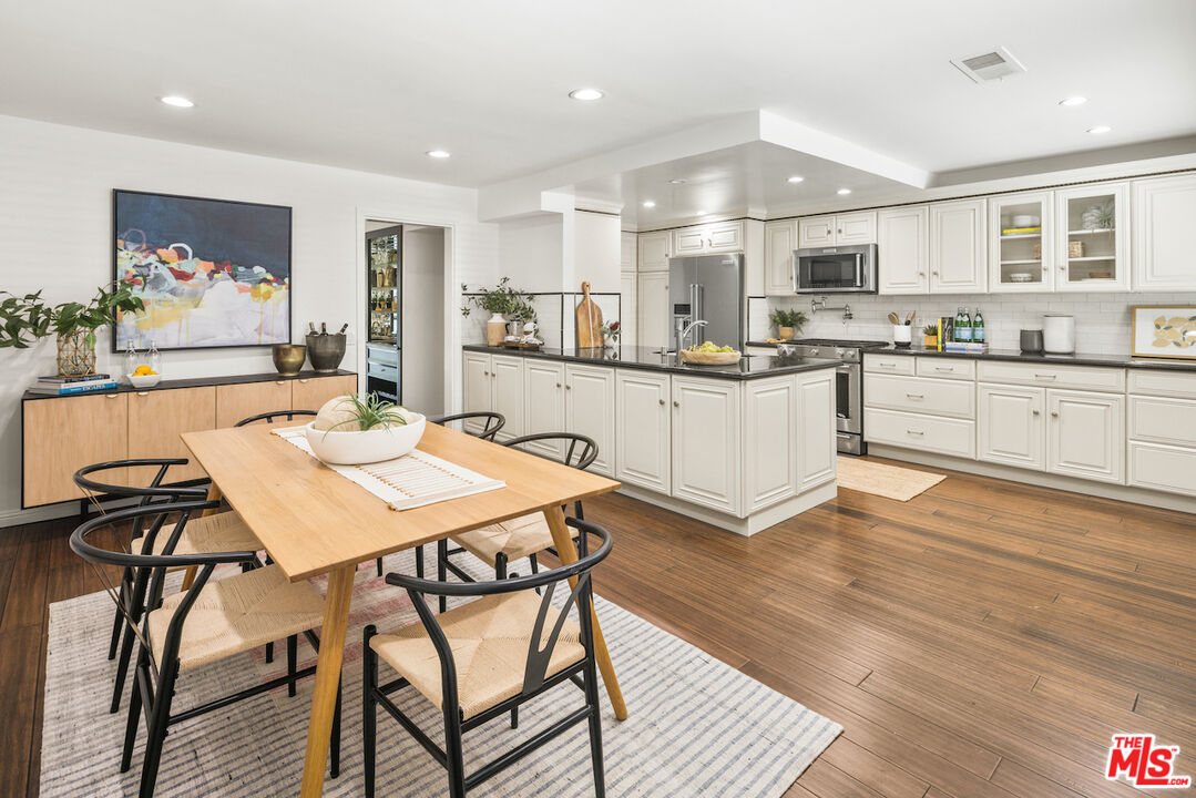 4549 Alla Road, Unit 5 Marina del Rey, CA 90292 - Photo 15 of 35 a kitchen with stainless steel appliances kitchen island granite countertop a sink and cabinets