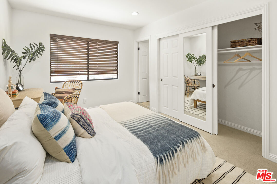 4549 Alla Road, Unit 5 Marina del Rey, CA 90292 - Photo 31 of 35 a bedroom with a bed and a refrigerator