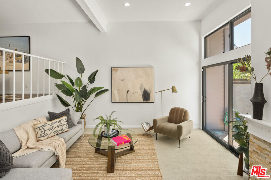 4549 Alla Road, Unit 5 Marina del Rey, CA 90292 - Photo 5 of 35 a living room with furniture and a flat screen tv